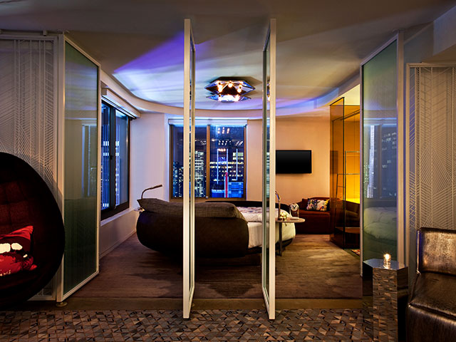 Movable wall panels allow the W Hotel Presidential Suite to take on different configurations for different function. Multiple windows offer a city view.