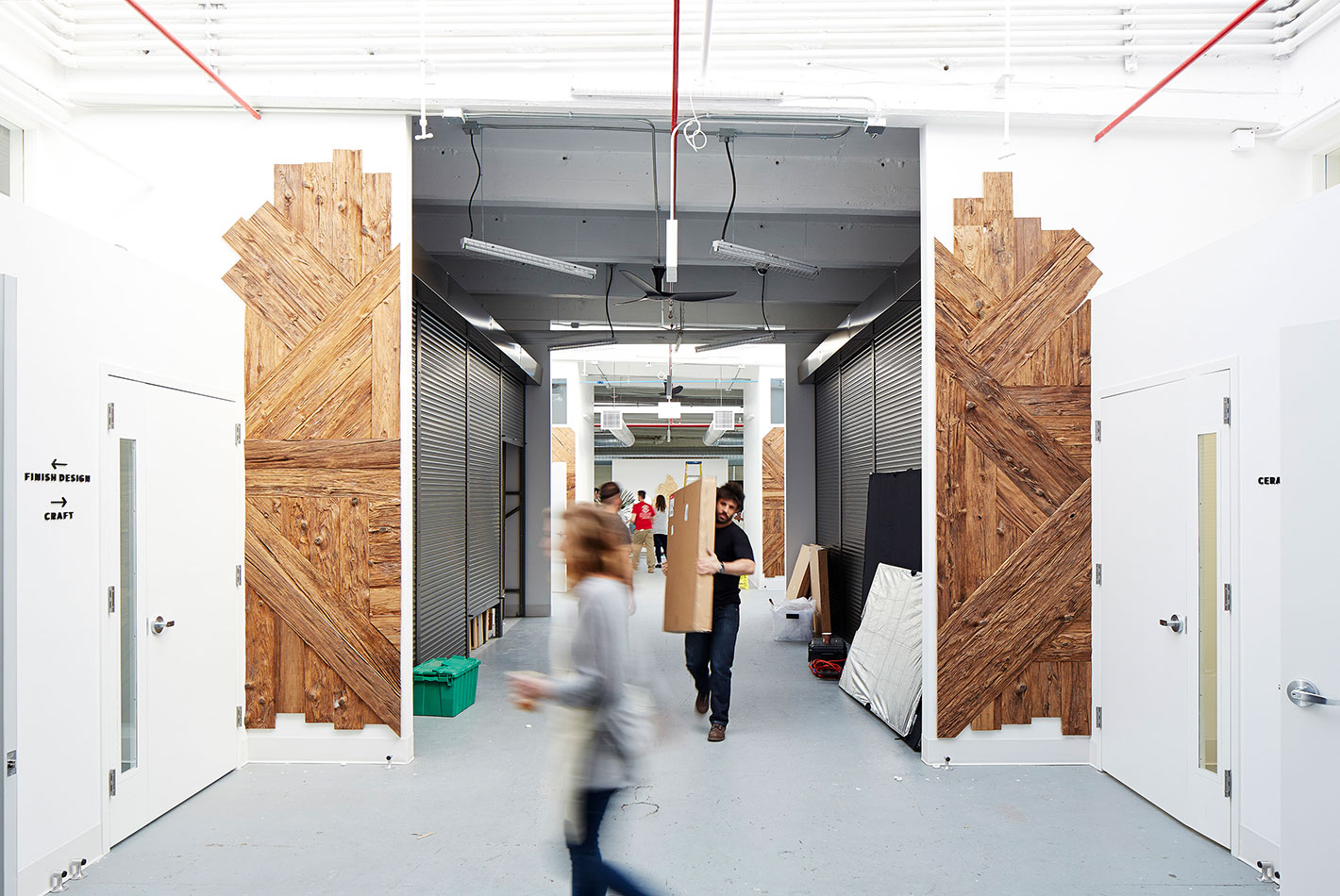 The interior entrance to West Elm's Maker's Studio are covered in signature wood paneling