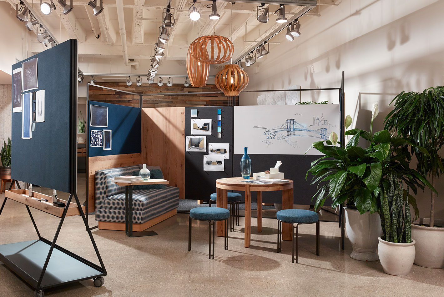 Casual seating and dining furniture set up in a sales vignette at West Elm's NeoCon showroom