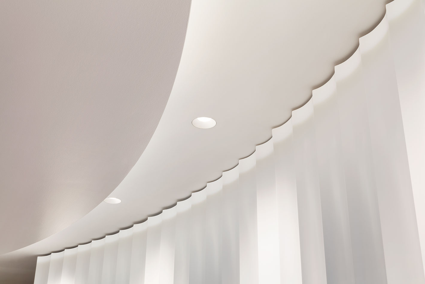 luted plaster curves around the oval shaped walls at1056 5th Ave