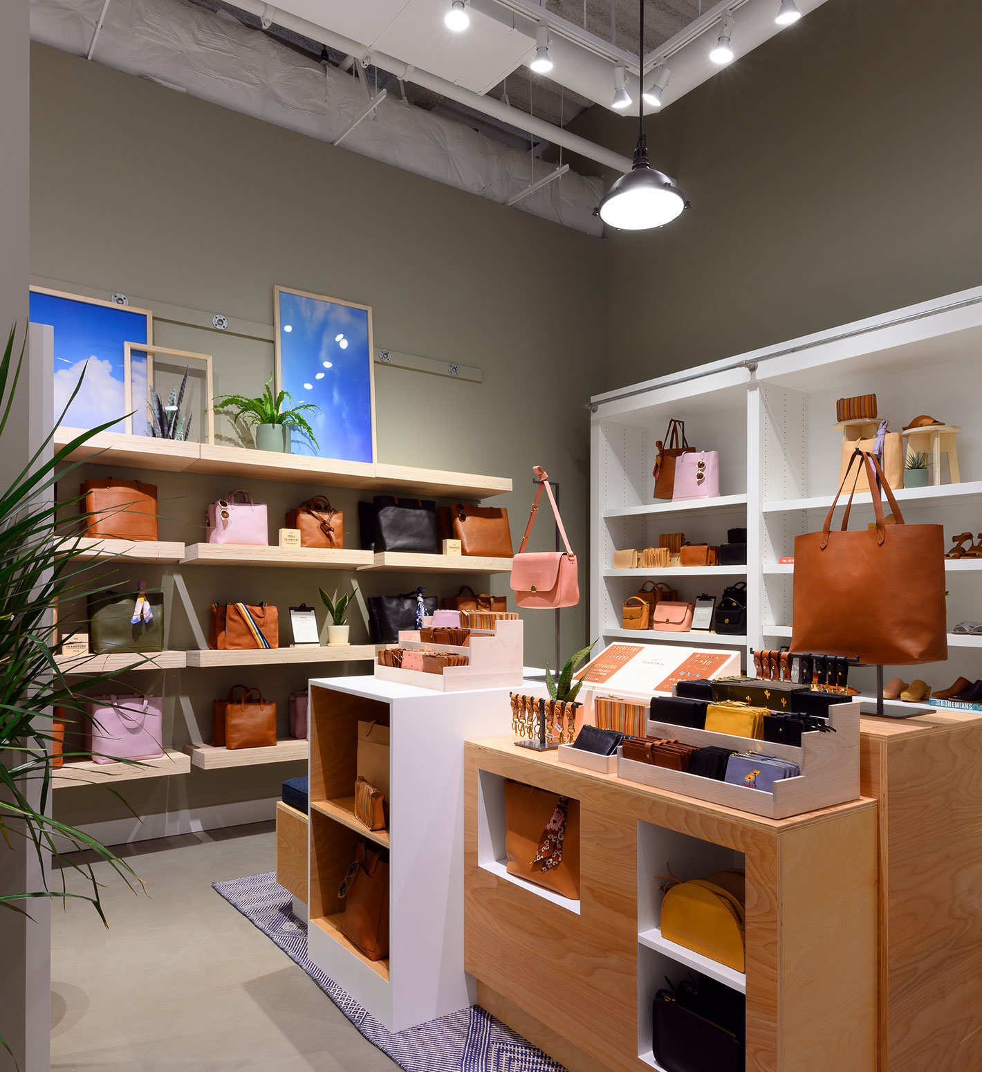Women's purses and tote bags in shades of brown and pink at the Madewell Store at the Shops at Hudson Yards.