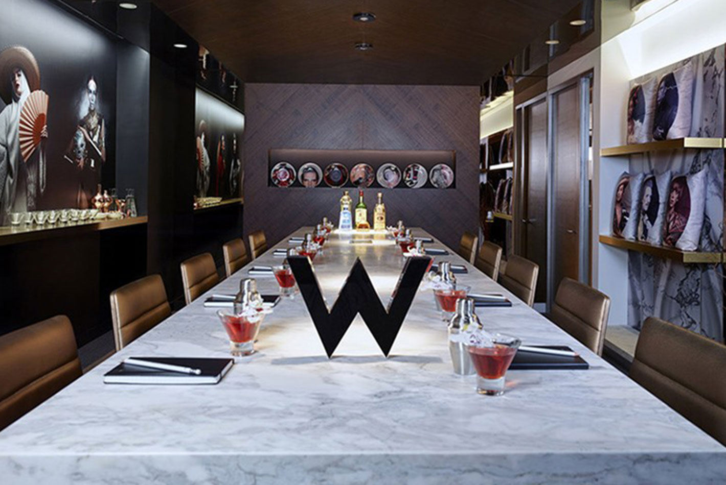 The W Hotel conference room at Starwood Design Studio has a white marble waterfall table and sleek desk chairs.